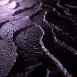 a puddle with dark water that is very close to it