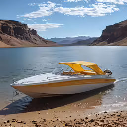 a boat on a beach near some mountains