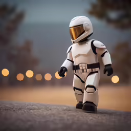 the toy figure has a helmet and a gold buckle