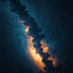 a long pipe of smoke is shown with bright orange lights