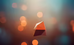 a colorful diamond shape is shown on the dark background