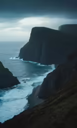 a view of the sea and cliffs with a sky background