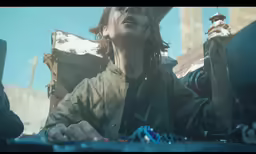 a girl is sitting on a motorcycle with her eyes closed