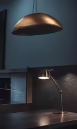 a metal lamp hanging above a table next to a wall