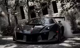 black car on a cobblestone street near some trees