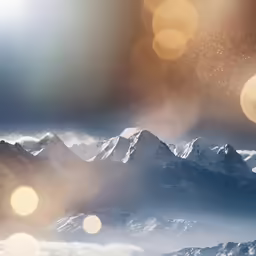 a mountain is in the distance with clouds and fog