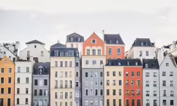 large buildings with black roof tops in a city