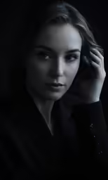 the woman is posing with her hands on her head