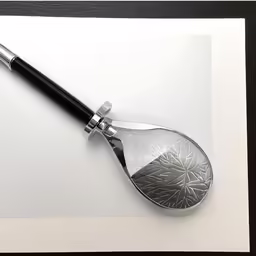 a spoon has been placed on top of a sheet of paper