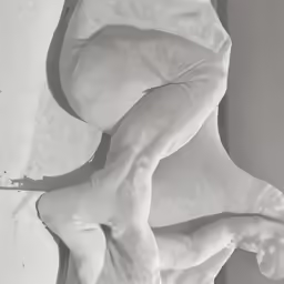the underside of a statue of a nude woman