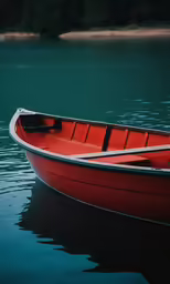 a red boat in the water with green lake behind it