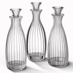 three clear glass vases on a white background