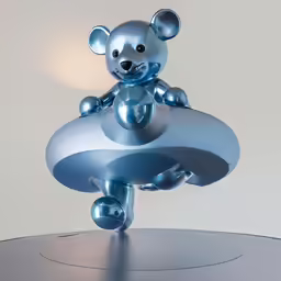 a stuffed animal sitting on top of a shiny table