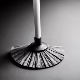 the light is on as it is placed next to a tall candle