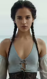 the woman in grey is dressed up with braids