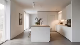 the large kitchen has a white island