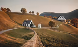 the houses are on the hill side on the road