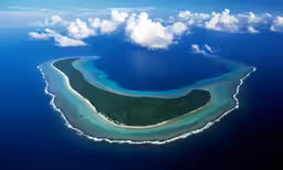 the water is almost white as it lays down in the middle of an island