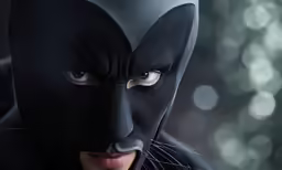a batman catwoman is wearing a black costume