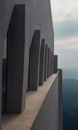 some large concrete pillars are against the sky