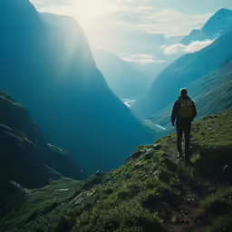 a person is hiking along side of some mountains