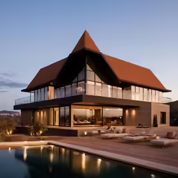 the inside of a large house with its pool at night