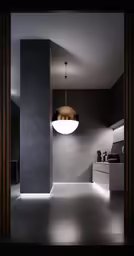 a dark room with a light hanging from the ceiling