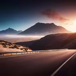 a big road going through the mountains with sun shining on it