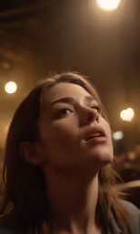 the woman is gazing up into the light