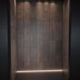 a empty room that has a wall that is decorated with square designs