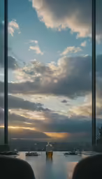 a table at an empty restaurant on top of a hill under cloudy skies