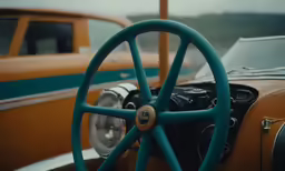a vehicle with a wood steering wheel and a blue spokes