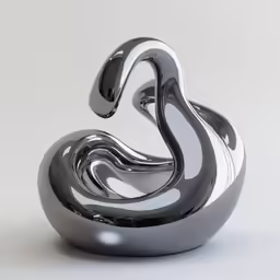 black and white abstract sculpture sitting on top of a table