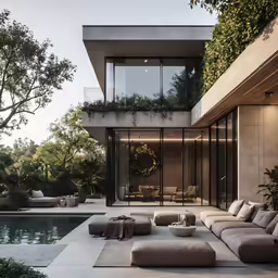 the house is outside with furniture by the pool