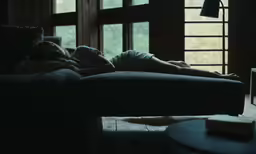 woman sleeping on a couch with her eyes closed
