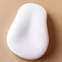 an odd looking ceramic object sitting on top of a table