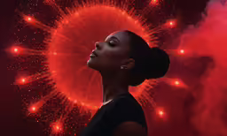a woman looking up with fireworks in the background