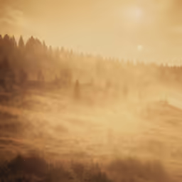 sun shining through fog and mist covering a mountain area