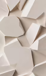 a white pile of folded paper with white sheets
