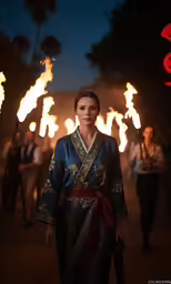 a person in a kimono is holding a torches