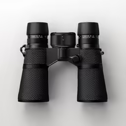 binoculars sitting on top of a black case