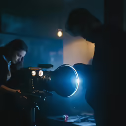 the woman is operating a video camera