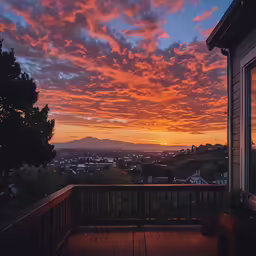 a view of the sunset as seen from a balcony