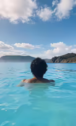 there is a man that is swimming in the water