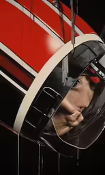 a woman wearing a helmet looking at the camera