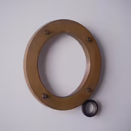 an object made out of a pair of scissors on top of a table