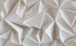 an abstractly made wall of paper with very thin pieces of origami