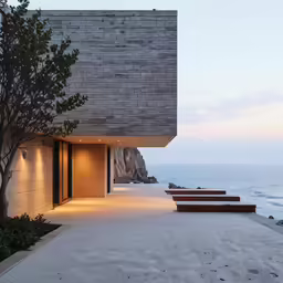 the concrete structure is designed around a series of benches along the beach