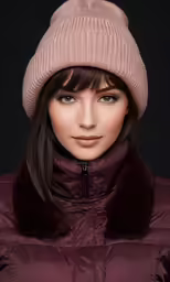 a beautiful woman wearing a purple hat