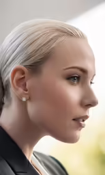 a woman with blonde hair is shown in profile